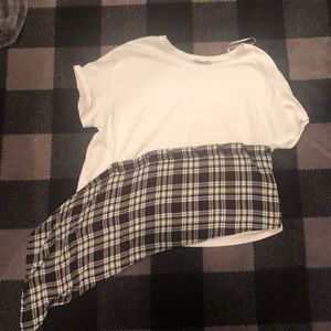 A white tee shirt with a plaid ruffle